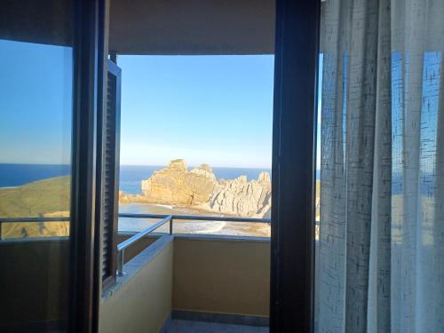 a view of the ocean from a hotel room window at La Venta del Mar in Liencres
