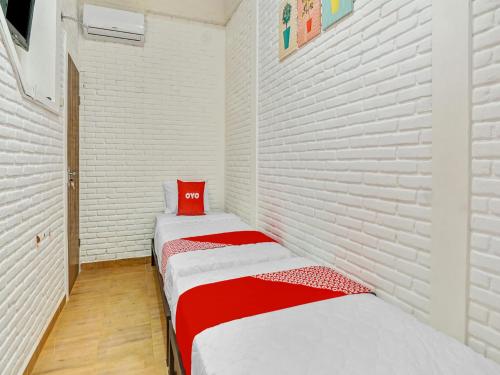 Letto o letti in una camera di Hotel O Ara Guest House