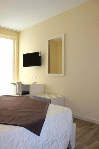 Televisyen dan/atau pusat hiburan di Faro Bianco Gallipoli - Suites & Apartments