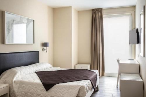 Katil atau katil-katil dalam bilik di Faro Bianco Gallipoli - Suites & Apartments