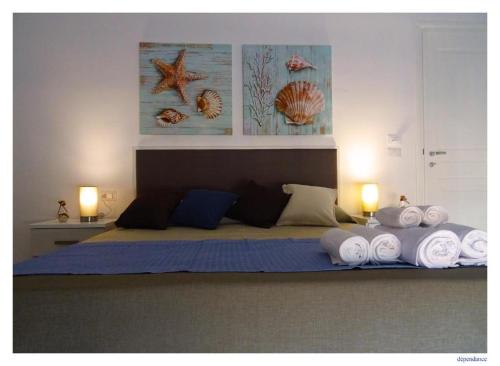 Katil atau katil-katil dalam bilik di Faro Bianco Gallipoli - Suites & Apartments