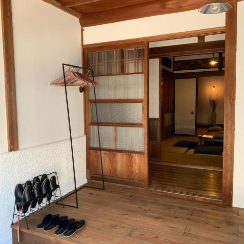 a group of shoes sitting on a floor in a room at uminca ウミンカ in Numazu