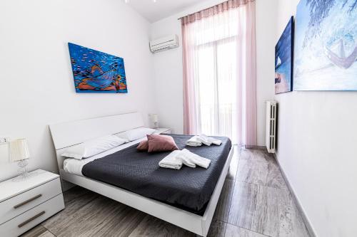 Postel nebo postele na pokoji v ubytování Mombello 50 - Sanremo city center