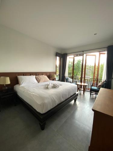Кровать или кровати в номере Baan Yaimai Boutique Samui