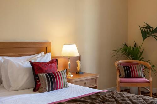 Ένα ή περισσότερα κρεβάτια σε δωμάτιο στο Amalia Hotel Nafplio