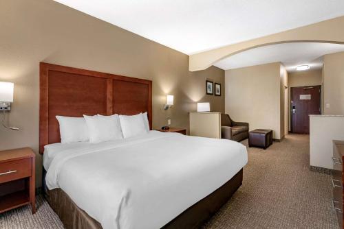 a large white bed in a hotel room at Comfort Inn & Suites St Louis-O'Fallon in O'Fallon