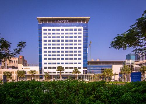 a large building with a nocet sign on it at Novotel World Trade Centre Dubai in Dubai