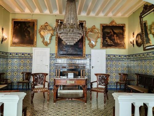 a living room filled with furniture and a fireplace at Hotel Simon in Seville