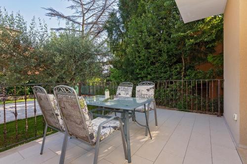 a table and chairs sitting on a patio at Apartments Paulino in Rovinj