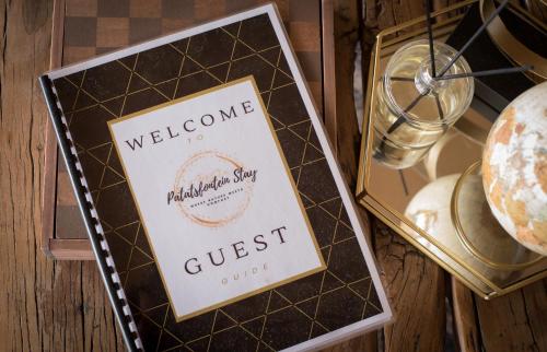 a sign that reads welcome to a malibu shop guest at Oakron at Patatsfontein Stay in Montagu