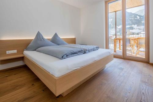Tempat tidur dalam kamar di Krone Apartments Top 6 / Top 7 / Top 8