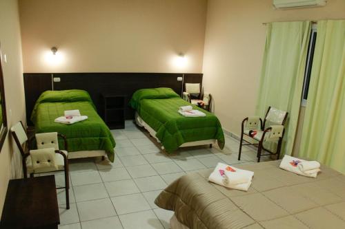 Tempat tidur dalam kamar di Hotel Cuesta de Miranda II