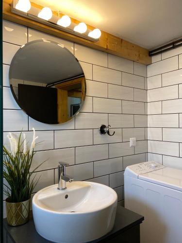 a bathroom with a sink and a mirror at Ktima Papadimitriou in Ioannina
