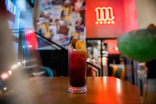 a drink sitting on top of a wooden table at Generator Madrid in Madrid
