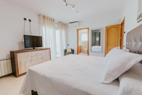 Postel nebo postele na pokoji v ubytování Collbato Resort.