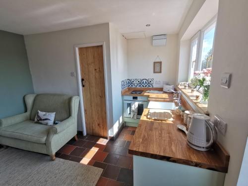 Kuchyň nebo kuchyňský kout v ubytování Cosy Coppice Cottage
