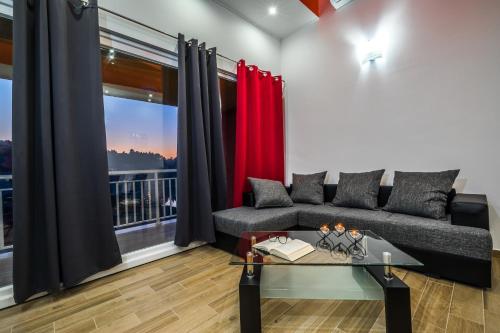 a living room with a couch and a window at Apartments Sunshine Home in Vela Luka