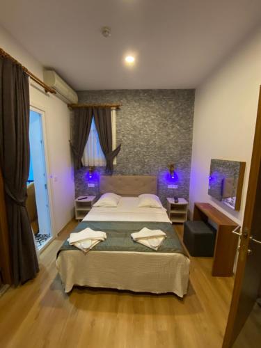 Postel nebo postele na pokoji v ubytování Masal Hotel