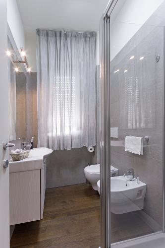 a bathroom with a sink and a toilet and a shower at CRIMA LEDA LUXURY in Misano Adriatico