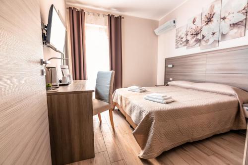 Ένα ή περισσότερα κρεβάτια σε δωμάτιο στο B&B DE CASA