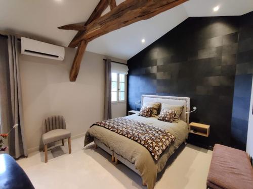 Cama o camas de una habitación en Le Lavoir des Capucins