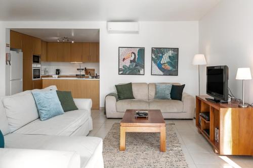 a living room with a couch and a coffee table at Villa Lantana in Vau