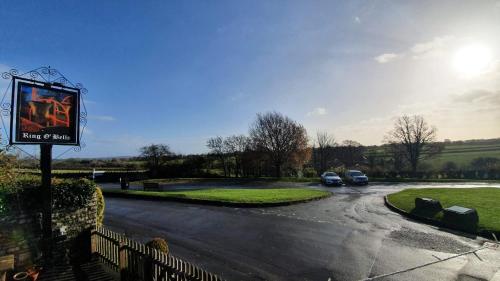 a parking lot with cars parked in a driveway at Ring O Bells Hinton Blewett in Bristol