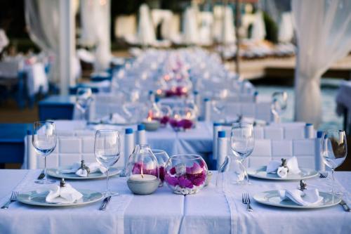 a long table with wine glasses and plates on it at Sabrinas Haus - Adult Only +14 in Bozburun