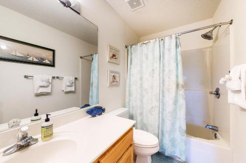a bathroom with a sink and a toilet and a shower at Seaside Searenity in Indian Pass
