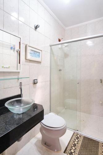 a bathroom with a sink and a toilet and a shower at Chalés Mirante da Lagoinha in Ubatuba