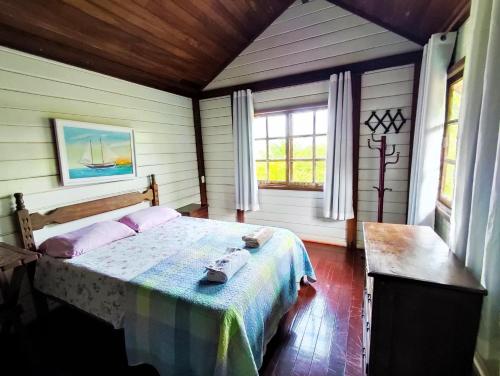 Postel nebo postele na pokoji v ubytování Linda Casa para Temporada em Manguinhos