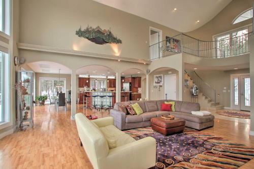 a large living room with a couch and a table at Secluded Home with Pool about 14 Mi to Coeur dAlene! in Post Falls