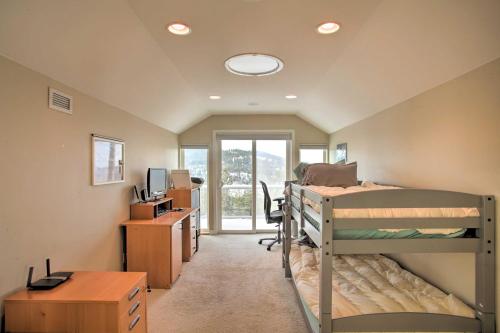 a room with two bunk beds and a desk at Secluded Home with Pool about 14 Mi to Coeur dAlene! in Post Falls