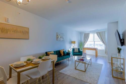 a living room with a couch and a table at Book Cozy King Bed Now 25 Percent OFF Spring Special! in Carteret