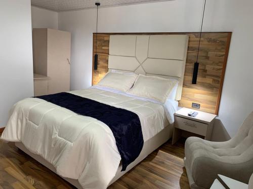Ein Bett oder Betten in einem Zimmer der Unterkunft Hotel Casa Modelia