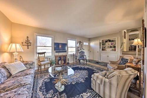 a living room with a couch and a table at Cozy Kansas City Home with Yard - 9 Mi to Dtwn! in Kansas City
