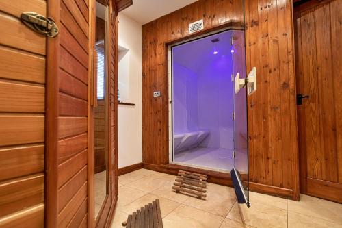 a bathroom with a shower with a glass door at Finest Retreats - Bretherdale Barn in Tebay