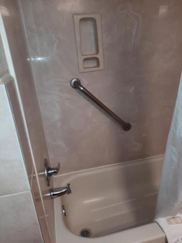 a shower in a bathroom with a handle at Quality Inn & Suites Grants - I-40 in Grants