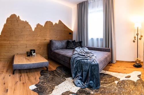 Ένα ή περισσότερα κρεβάτια σε δωμάτιο στο Apartments Rainer - Val Gardena