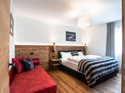 Ένα ή περισσότερα κρεβάτια σε δωμάτιο στο Apartments Rainer - Val Gardena