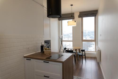 Η κουζίνα ή μικρή κουζίνα στο Kostjukowski Apartments Forum