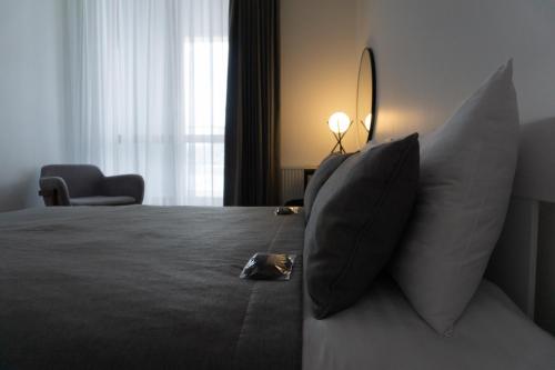 Ένα ή περισσότερα κρεβάτια σε δωμάτιο στο Kostjukowski Apartments Forum