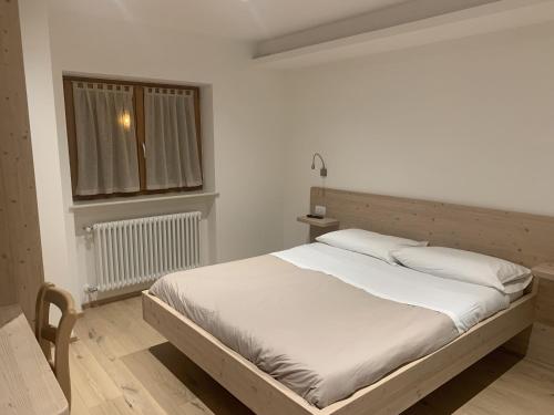 Postel nebo postele na pokoji v ubytování La locanda di Geppetto