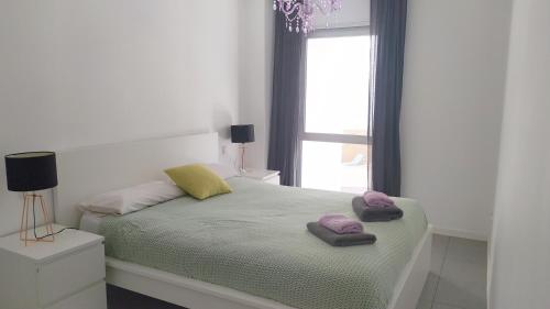 A bed or beds in a room at Casa Rincón Medanero
