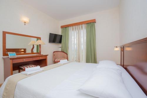 En eller flere senger på et rom på Rooms Plava Laguna