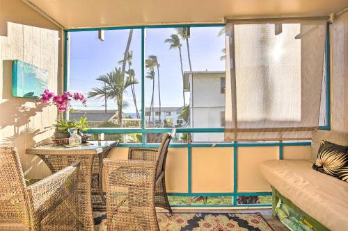 a balcony with a couch and chairs and a table at Lanai and Community Pool Access Sunny Central Condo in Kailua-Kona