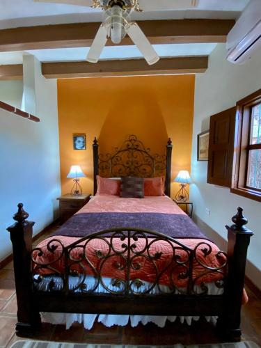 a bedroom with a large bed in a room at Hotel Casa María Félix in Álamos
