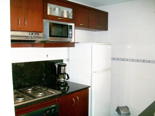 Kitchen o kitchenette sa Apartamento en edificio Santorini