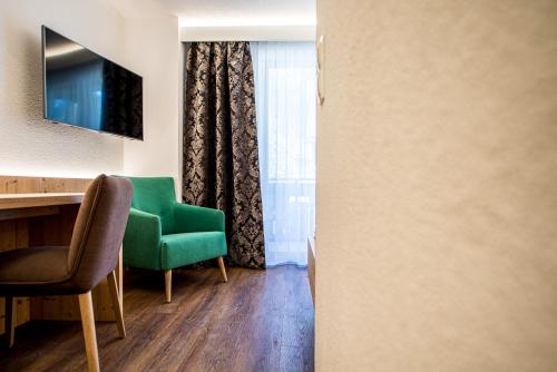 Télévision ou salle de divertissement dans l'établissement Alphotel Stocker Alpine Wellnesshotel