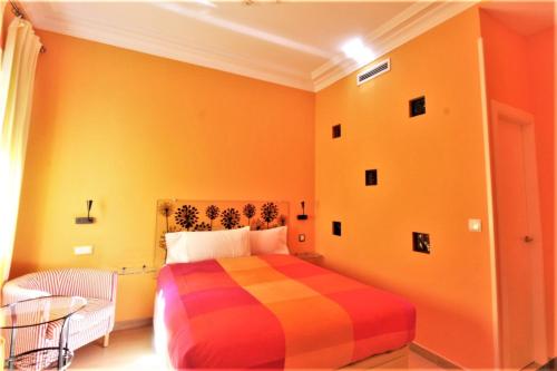 Postel nebo postele na pokoji v ubytování Hostal Arco Iris